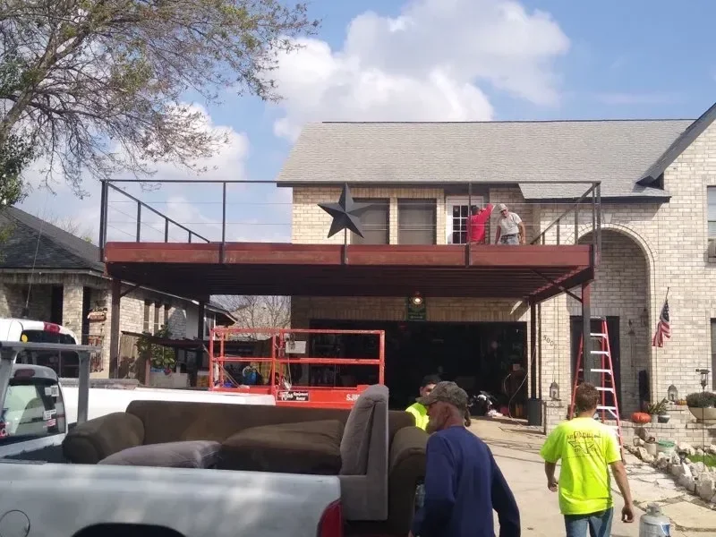 Steel patio cover and deck structure in Texas backyard